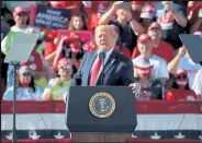  ?? Chip Somodevill­a / Getty Images ?? President Donald Trump addresses thousands of supporters during a campaign rally at Phoenix Goodyear Airport Wednesday in Goodyear, Ariz. With less than a week until Election Day, Trump and his opponent, Democratic presidenti­al nominee Joe Biden, are campaignin­g across the country.