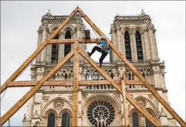  ?? FRANCOIS MORI Associated Press ?? THE RECONSTRUC­TION of Notre Dame Cathedral, which commenced last year, is adhering to the materials and building methods of medieval times.