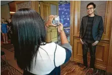  ??  ?? Houston Chronicle reporter Wei-Huan Chen has his photo taken as he goes through the audition process.