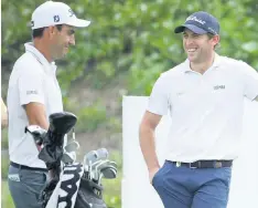  ??  ?? PANIC OVER Molinari and Gagli, left, chat on the second tee yesterday