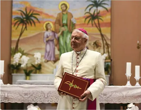  ?? Khushnum Bhandari / The National ?? Bishop Paul Hinder, who is retiring this summer, pictured in St Joseph’s Cathedral in Abu Dhabi