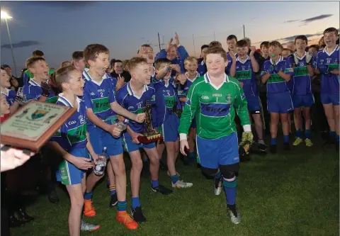  ??  ?? BIGGEST CHEER EVER: Delighted AGB teammates cheering their keeper Denis O’Reilly on winning a well deserved Man of the Match award after the Under-13 ’B’ football championsh­ip final between AGB and Aughrim.