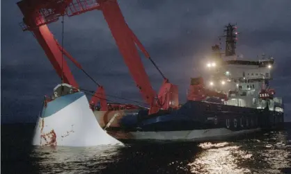  ??  ?? The bow door of the Estonia is lifted from the sea in November 1994. Photograph: Jaakko Avikainen/Lehtikuva/AFP/Getty Images