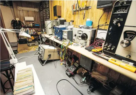  ?? QC PHOTO BY RANDON HARDER ?? The workshop of veteran ham radio operator Stan Ewert, located in the basement of his White city home. Over the years, Ewert has contacted other radio operators from all over the world.