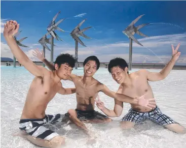  ?? Picture: ANNA ROGERS ?? COOL CUSTOMERS: Japanese tourists Ota Masanari, Hiroyuki Kitayama and Owada Tomohiko enjoying Cairns Lagoon.