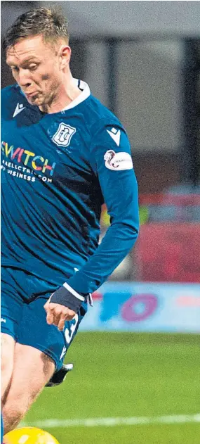  ?? Picture: SNS. ?? Dundee’s Jordan McGhee, who had surgery on his wrist, is determined to be ready to play again if the season resumes.