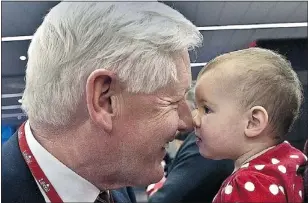  ?? — POSTMEDIA NEWS ?? Bob Rae rubs nose with little Claire Littler after he registers for the Liberal convention in Ottawa.