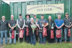  ??  ?? Anna Morrison presents the prizes to the winners of the Glenfiddic­h Challenge Trophy Shoot at Glendaruel and Colintraiv­e Gun Club.