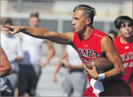  ??  ?? Hart quarterbac­k JT Shrout looks for an opening in the defense as he goes for the quarterbac­k keeper during a competitio­n with Crescenta Valley at Hart on Wednesday.