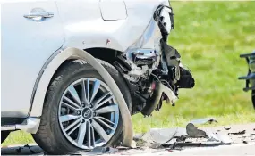  ??  ?? Damage to a white SUV is seen Thursday at the scene of an accident involving officers in the funeral procession for fallen Tulsa Police Sgt. Craig Johnson on the Kilpatrick Turnpike.