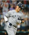  ?? DREAMSTIME ?? Aaron Judge of the New York Yankees rounds the bases on Oct. 4 after hitting his American-League record 62nd home run of the season.