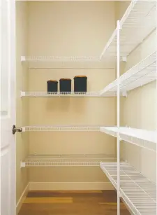  ?? SHANE HOMES ?? Wire shelves are a convenient choice for pantry storage.
