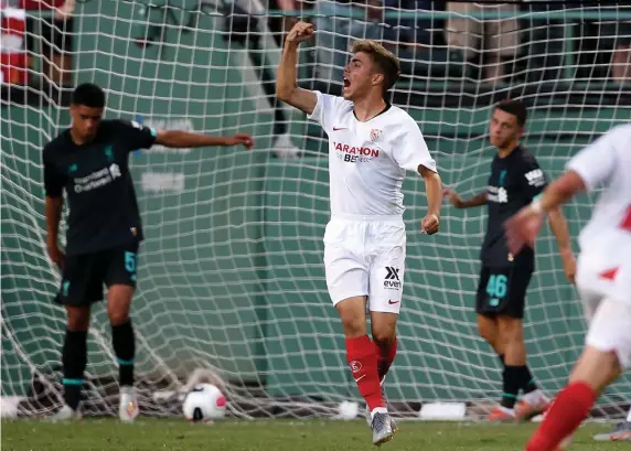  ?? NANCY LANE / BOSTON HERALD ?? FIRED UP: Sevilla’s Alejandro Pozo Pozo celebrates his go-ahead goal in last night’s 2-1 friendly win against Liverpool at Fenway Park.