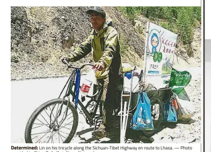  ?? — Photo provided to China Daily/Asia News Network ?? Determined: Lin on his tricycle along the Sichuan-Tibet Highway en route to Lhasa.