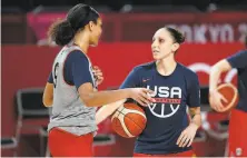  ?? Charlie Neibergall / Associated Press ?? Diana Taurasi (right) talks with A’ja Wilson during a practice in Saitama, Japan, for the U.S. women’s basketball team.