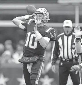  ?? STEVEN SENNE/AP ?? Patriots quarterbac­k Mac Jones throws a pass against the Cleveland Browns on Sunday in Foxborough, Mass.