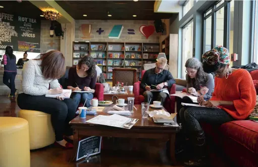  ?? PICTURES: WASHINGTON POST ?? DOWNTIME: Colouring book enthusiast­s meet at Busboys and Poets in Washington. Colouring books for adults are suddenly a big business, a bright spot in the financial results of publishers and retailers alike, and seem to signal a trend in creative,...