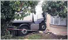  ??  ?? IMPACT Driver was cut free from cab wedged into damaged house