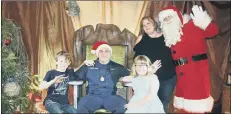  ??  ?? REUNITED Chris Tisdell with his wife Helen and children, Lois and Ewan at Santa's Grotto at Marwell Zoo