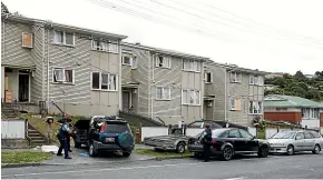  ??  ?? Armed police search vehicles after a gang brawl in the Hutt Valley suburb of Stokes Valley, north of Wellington. THOMAS MANCH/STUFF