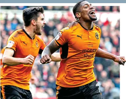  ?? MI NEWS & SPORT ?? On the rise: Ivan Cavaleiro (right) celebrates Wolves’ second with Ruben Neves