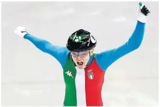  ?? [JULIE JACOBSON/THE ASSOCIATED PRESS] ?? Arianna Fontana of Italy reacts as she crosses the finish line to win the 500 meters short track speedskati­ng final in the Gangneung Ice Arena at the Winter Olympics Tuesday in Gangneung, South Korea.