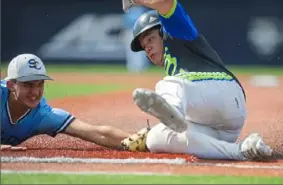  ?? Haldan Kirsch/ Post- Gazette ?? Steel City Select first baseman Matt DiRenzo tags out FTB Tucci Northeast’s Drew Hiller during the Pitt Baseball Summer Team Camp Saturday at Petersen Sports Complex in Oakland.