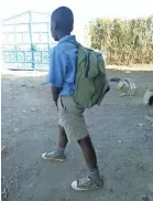  ??  ?? Said Sefu, 10, wears his school uniform even though his school, Basuba Primary, has been closed for three years. “There are no teachers,” he says. “When you go to school you only see soldiers patrolling.” TONNY ONYULO