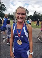  ?? Contribute­d photo ?? Medal winner: Ali Looney reacts after winning a medal during a cross country meet this season.