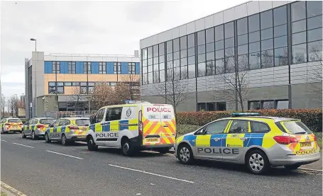  ?? Picture: PA. ?? A line of police vehicles outside Edinburgh College in Granton after an officer was stabbed.