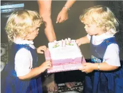  ??  ?? Icing with that . . . Kimberley Ashton (left) and Melissa Connell, aged 2.