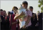  ?? ERIC GAY — THE ASSOCIATED PRESS ?? Justin Thomas holds the Wanamaker Trophy after winning the PGA Championsh­ip in a playoff against Will Zalatoris at Southern Hills Country Club on Sunday in Tulsa, Okla.