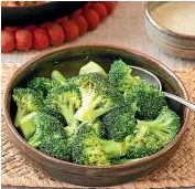  ?? NICOLA GALLOWAY ?? Top: Baked meatballs with tahini sauce. Above: Flash-cooked broccoli.