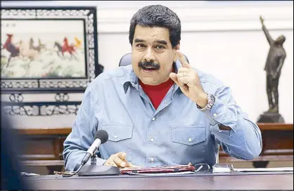  ?? EPA ?? A handout picture from Miraflores Press shows Venezuelan President Nicolas Maduro during a meeting with members of his government at the Presidenti­al Palace in Caracas, Venezuela Friday.