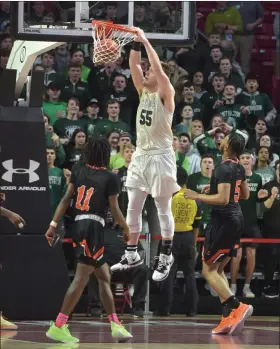  ?? MEDIA NEWS GROUP FILE PHOTO ?? Methacton’s (55) Jeff Woodward dunks it in the fourth quarter against Chester.