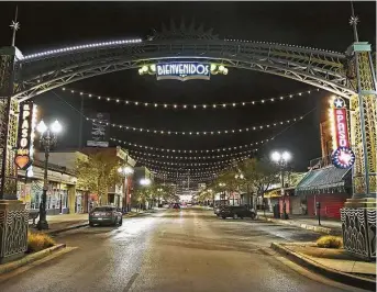  ?? Bob Owen / Staff photograph­er ?? El Paso Street sits deserted in El Paso, where a curfew has been in place because of a recent surge in coronaviru­s cases. A two-week shutdown order was issued by the county judge in October.