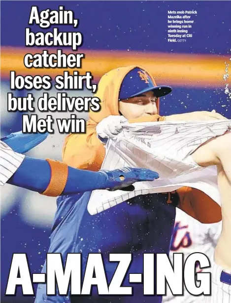  ?? GETTY ?? Mets mob Patrick Mazeika after he brings home winning run in ninth inning Tuesday at Citi Field.