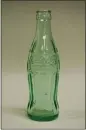  ?? COURTESY OF MARIN HISTORY
MUSEUM ?? “Georgia Green” glass CocaCola bottle from the San Rafael Coca-Cola bottling plant, c. 1950s, part of “Unbottled.”