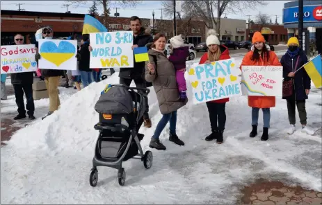  ?? Photo by Matthew Liebenberg ?? People show their support for Ukraine and opposition to the Russian invasion during a rally at Market Square in downtown Swift Current, Feb. 27.