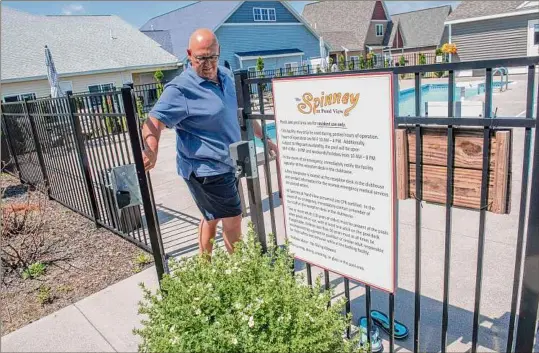  ?? ?? The amenities at The Spinney at Pond View , including the pool here, is part of what drew Chet Fiske and his wife (both seen in the lower left photo) to the community. Those perks also include gardening, which Fiske is seen doing in the lower right photo.