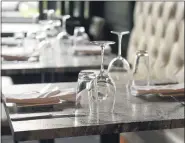  ??  ?? Glasses on a table in the dining room.