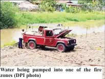  ?? ?? Water being pumped into one of the fire zones (DPI photo)