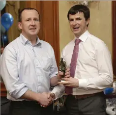  ??  ?? Club Chairman Nick Nolan presents the Junior Player of the Year award to Colm O’Brien. Photos: Barbara Flynn