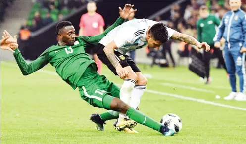  ??  ?? Wilfred Ndidi (13) of Nigeria tackles and Argentine player during their internatio­nal friendly game in Rusia last year.