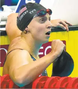  ?? PETR DAVID JOSEK AP ?? Katie Ledecky of the United States looks for her time after winning the women’s 800-meter freestyle final at the FINA World Championsh­ips in Budapest, Hungary.