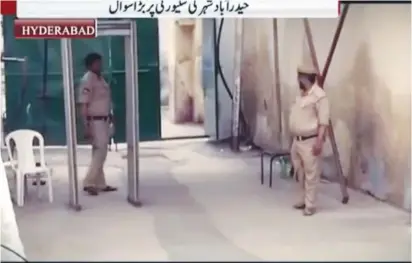  ?? (Screenshot) ?? SECURITY PERSONNEL stand by a metal detector at the Mecca Masjid in Hyderabad, one of the largest mosques in India.