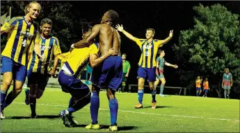  ?? Natalie Howard/JBU Sports Informatio­n ?? John Brown University men’s soccer players celebrate after the Golden Eagles scored the match’s only goal with 21.7 seconds left against No. 19 MidAmerica Nazarene on Friday at Alumni Field.