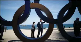  ?? Picture: Reuters ?? TENSE TIMES: A man looks at the Olympic Rings at a beach in Gangneung, South Korea.