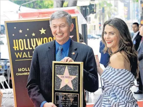  ?? Albert L. Ortega Getty Images ?? ONE OF Leron Gubler’s duties is to serve as master of ceremonies for Walk of Fame inductions, such as the one for Keri Russell in May.