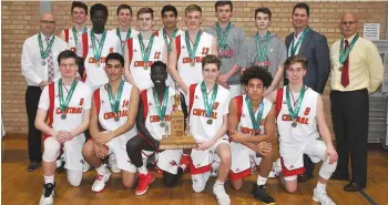  ??  ?? The Central Cyclones gather for the customary team photo after winning their third straight high school senior boys basketball title.